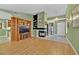 Spacious living room with a fireplace, built-in shelving, laminate floors, and neutral paint at 7713 Shore Haven Dr, Las Vegas, NV 89128