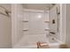 Bathroom with a tub and shower featuring brushed nickel fixtures and white interior at 8600 W Charleston Blvd # 2086, Las Vegas, NV 89117