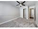 Bedroom featuring neutral paint, carpet, ceiling fan and a closet with sliding doors at 8600 W Charleston Blvd # 2086, Las Vegas, NV 89117
