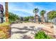 Outdoor community space with picnic tables, mature trees, and well-maintained landscaping at 8600 W Charleston Blvd # 2086, Las Vegas, NV 89117