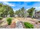 Landscaped walkway with mature trees and desert plants winding through the community at 8600 W Charleston Blvd # 2086, Las Vegas, NV 89117