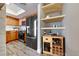 Modern kitchen with stainless steel appliances, wood cabinets, and a stylish wine rack feature at 8600 W Charleston Blvd # 2086, Las Vegas, NV 89117