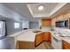 Bright kitchen featuring wood cabinets, quartz countertops, and stainless steel microwave at 8600 W Charleston Blvd # 2086, Las Vegas, NV 89117