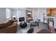 Staged living room features a stone fireplace, contemporary furnishings, and ample natural light at 8600 W Charleston Blvd # 2086, Las Vegas, NV 89117