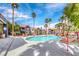 Community swimming pool surrounded by lounge chairs and well-maintained landscaping under a sunny sky at 8600 W Charleston Blvd # 2086, Las Vegas, NV 89117