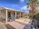 Backyard featuring a hot tub, covered patio, barbecue and mature landscaping at 9211 Wittig Ave, Las Vegas, NV 89149