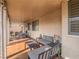 Inviting covered patio with comfortable seating and views of the backyard at 9211 Wittig Ave, Las Vegas, NV 89149