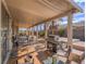 Large covered patio perfect for outdoor dining and relaxation with BBQ and seating at 9211 Wittig Ave, Las Vegas, NV 89149