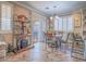 Bright dining area with tile floors, decorative shelving, and sliding glass doors to the outside at 9211 Wittig Ave, Las Vegas, NV 89149