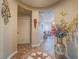 Open foyer with decorative tile flooring and a view into the living room at 9211 Wittig Ave, Las Vegas, NV 89149