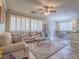 Spacious living room featuring neutral decor, plantation shutters and tile floors at 9211 Wittig Ave, Las Vegas, NV 89149