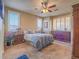 Spacious main bedroom featuring a ceiling fan, plantation shutters and carpeted floors at 9211 Wittig Ave, Las Vegas, NV 89149