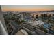 Panoramic view showcasing the surrounding city, featuring a pool area and a nearby golf course at 145 E Harmon Ave # 1202, Las Vegas, NV 89109