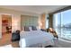 Bright bedroom with a large window and city view plus connecting sitting area at 145 E Harmon Ave # 1202, Las Vegas, NV 89109