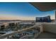 Captivating city view from a balcony, showcasing a resort-style pool and iconic buildings against a vibrant skyline at 145 E Harmon Ave # 1202, Las Vegas, NV 89109