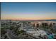 Scenic city view at dusk, featuring the cityscape and pool area in the foreground, offering a tranquil ambiance at 145 E Harmon Ave # 1202, Las Vegas, NV 89109