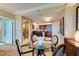 Bright dining area with a glass table and easy access to the bathroom and kitchen at 145 E Harmon Ave # 1202, Las Vegas, NV 89109