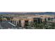 Exterior shot of a building with palm trees, cabanas, landscaping, and a parking area at 145 E Harmon Ave # 1202, Las Vegas, NV 89109