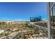 Balcony view of the city, pool area, and palm trees at 145 E Harmon Ave # 1202, Las Vegas, NV 89109