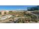 Balcony view of the city, pool area, and palm trees at 145 E Harmon Ave # 1202, Las Vegas, NV 89109