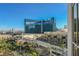 Balcony view of the city, pool area, and palm trees at 145 E Harmon Ave # 1202, Las Vegas, NV 89109