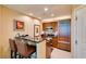 Modern kitchen features dark countertops, wooden cabinets, stainless steel appliances, and seating at 145 E Harmon Ave # 1202, Las Vegas, NV 89109