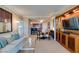 Spacious living area featuring a large built-in entertainment center and adjacent dining and kitchen areas at 145 E Harmon Ave # 1202, Las Vegas, NV 89109