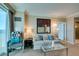 Well-lit living room features a cozy sofa, modern artwork, and a serene atmosphere at 145 E Harmon Ave # 1202, Las Vegas, NV 89109