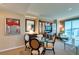 Inviting living room with dining table, built-in cabinets, comfortable seating, and bright natural light at 145 E Harmon Ave # 1202, Las Vegas, NV 89109