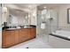 Bathroom showcases a double vanity, walk-in shower, and separate soaking tub at 145 E Harmon Ave # 2603, Las Vegas, NV 89109