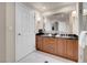 This bathroom offers a double vanity with a granite countertop and a walk-in shower at 145 E Harmon Ave # 2603, Las Vegas, NV 89109