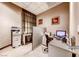 Small office space featuring a desk with computer, office chair, filing cabinet, and a printer for tenant use at 145 E Harmon Ave # 2603, Las Vegas, NV 89109