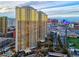 Stunning exterior view of high-rise building, showcasing its architectural design and surrounding city landscape at 145 E Harmon Ave # 2603, Las Vegas, NV 89109
