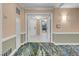 Hallway with view into a unit through double doors and elegant carpets at 145 E Harmon Ave # 2603, Las Vegas, NV 89109