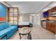 Open concept living room area featuring modern furnishings and a partial kitchenette and dining area at 145 E Harmon Ave # 2603, Las Vegas, NV 89109