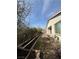 Backyard featuring a brick patio, mature landscaping, and a garden bed at 1617 Meadow Bluffs Ave, Henderson, NV 89014