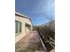 Cozy backyard featuring brick pavers, mature landscaping, and convenient access to the home at 1617 Meadow Bluffs Ave, Henderson, NV 89014