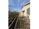 Backyard featuring a brick patio, mature landscaping, and a garden bed at 1617 Meadow Bluffs Ave, Henderson, NV 89014