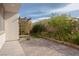 Backyard featuring a brick-paved patio, mature landscaping, and wooden trellis at 1617 Meadow Bluffs Ave, Henderson, NV 89014