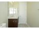 Bathroom with a dark wood vanity, white marble countertop, and large mirror at 1617 Meadow Bluffs Ave, Henderson, NV 89014
