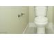 Bathroom toilet with neutral walls and gray tile floors at 1617 Meadow Bluffs Ave, Henderson, NV 89014