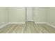 Empty bedroom featuring modern floors, baseboards, and neutral paint at 1617 Meadow Bluffs Ave, Henderson, NV 89014