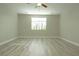 Spacious bedroom with a large window, light wood floors, and neutral paint, perfect for relaxation at 1617 Meadow Bluffs Ave, Henderson, NV 89014
