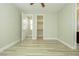 An open bedroom with a light-colored floor and white trim at 1617 Meadow Bluffs Ave, Henderson, NV 89014