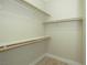 A closet with wooden shelving and a light-colored floor at 1617 Meadow Bluffs Ave, Henderson, NV 89014