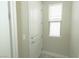 Entryway featuring a white door, trim, and a natural-light window at 1617 Meadow Bluffs Ave, Henderson, NV 89014