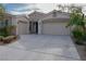 Charming home featuring a two-car garage, well-maintained landscaping, and a welcoming driveway at 1617 Meadow Bluffs Ave, Henderson, NV 89014