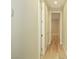 Hallway with wood flooring and access to multiple rooms at 1617 Meadow Bluffs Ave, Henderson, NV 89014