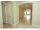 Inviting hallway with arched doorways and wood flooring leading to the bedrooms and main living areas at 1617 Meadow Bluffs Ave, Henderson, NV 89014