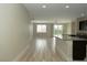 Open-concept kitchen featuring a breakfast bar, granite countertops, and ample natural light at 1617 Meadow Bluffs Ave, Henderson, NV 89014